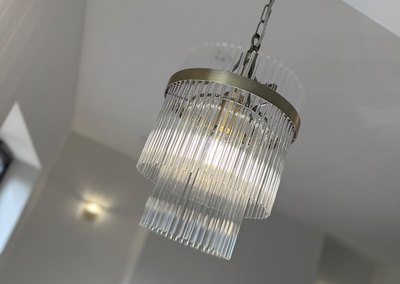 Tiered glass pendant light fitted to a hallway ceiling